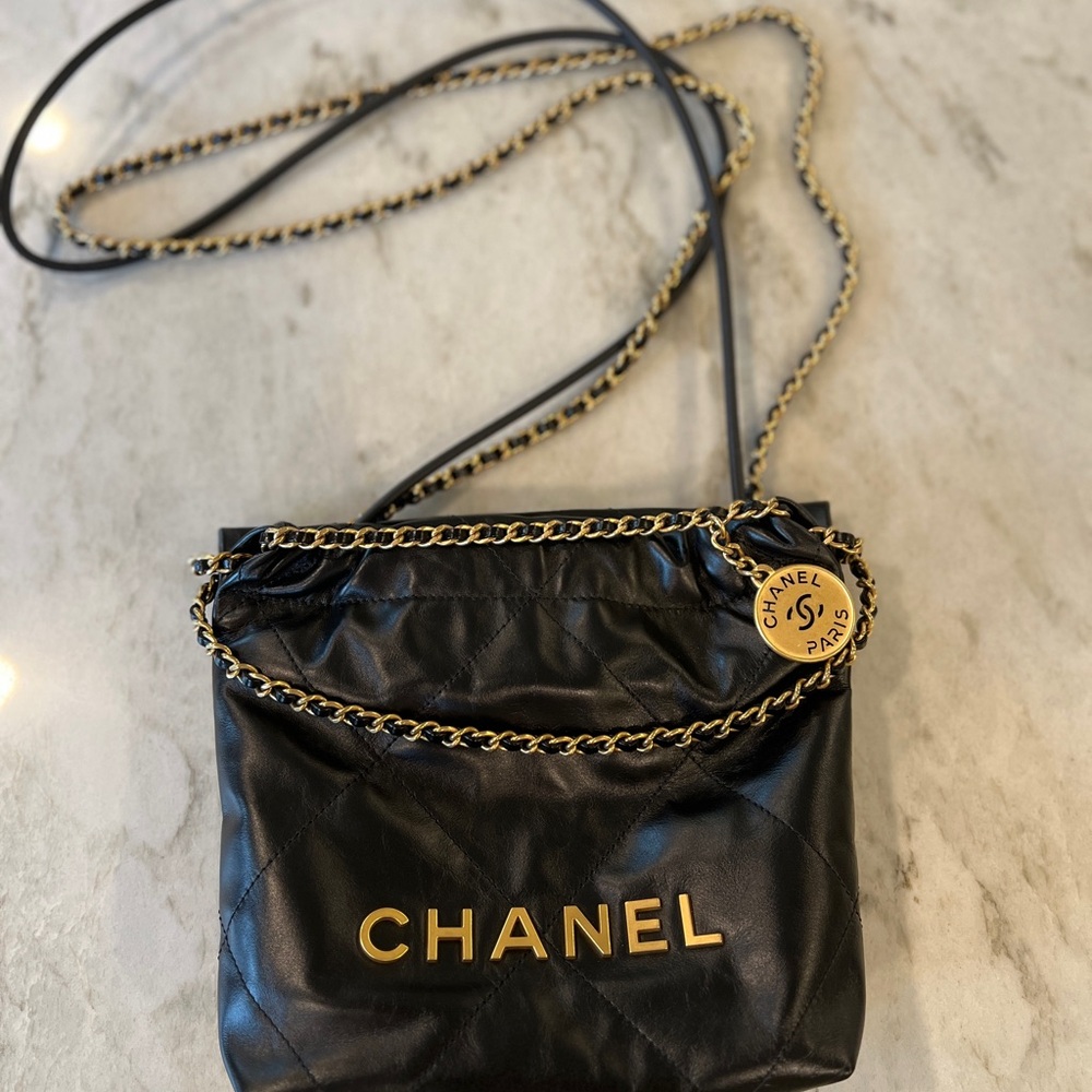 CHANEL BLACK LEATHER MINI 22 bag with original everything incl shopping bag.